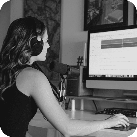 Woman editing podcast on computer